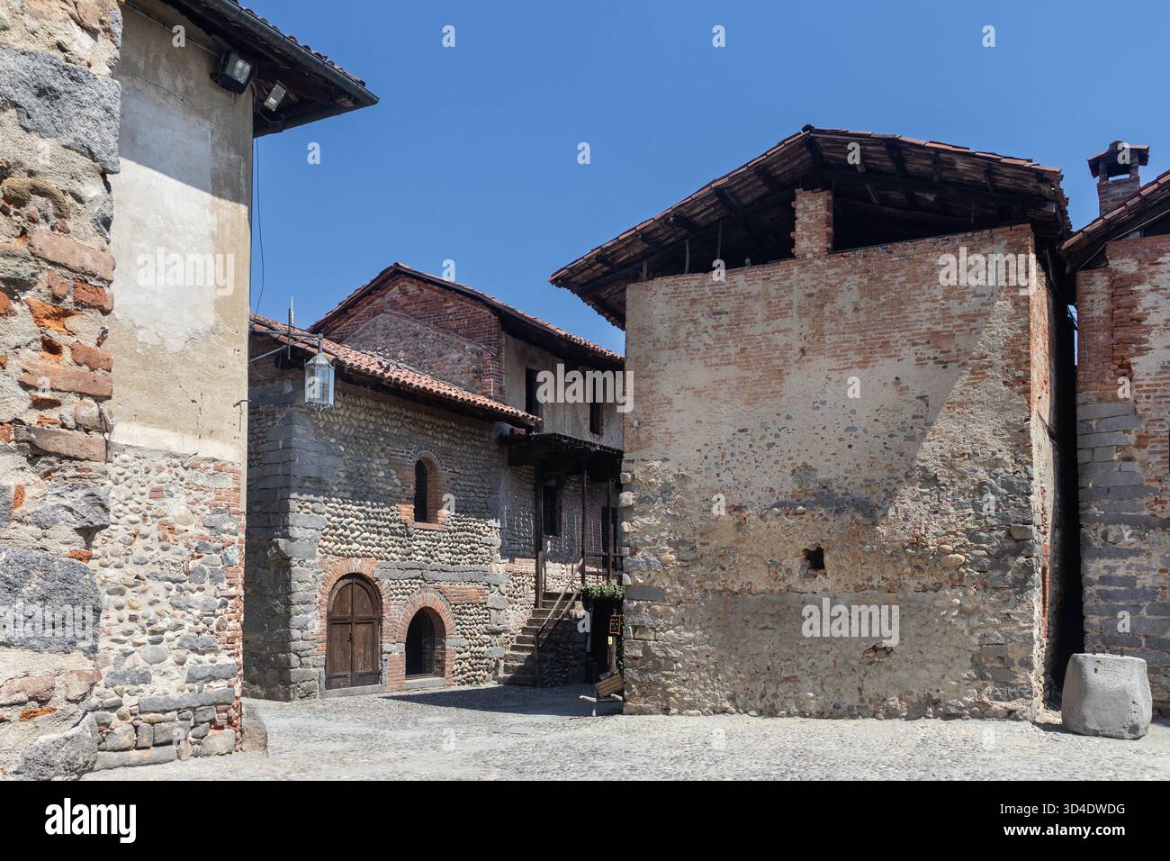 CANDELO, ITALY, 28 JULY 2024: Quaint square and old buildings at the Ricetto di Candelo. The collection of medieval buildings in the Ricetto, near Bie - Stock Image