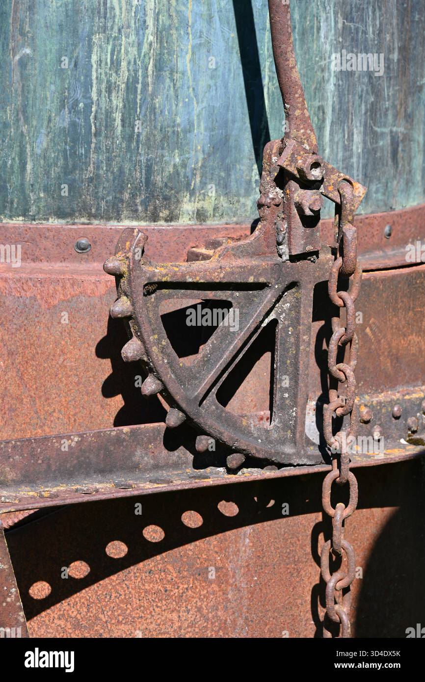 Detail of Old Rusty Cog, Cogwheel, Gear or Toothed Wheel of Vintage Lavender Still or Alembic Stock Photo