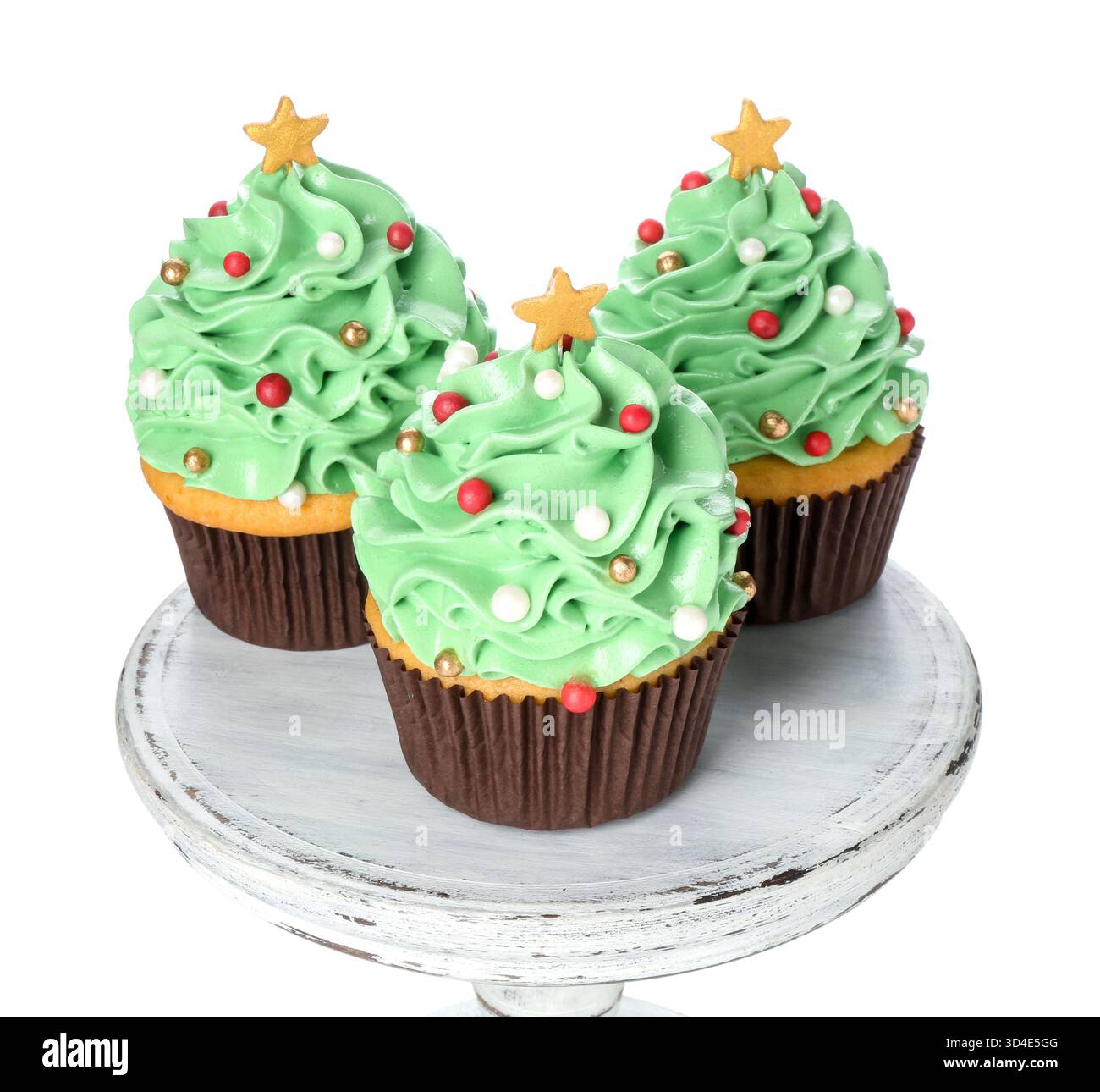 Christmas tree shaped cupcakes isolated on white Stock Photo