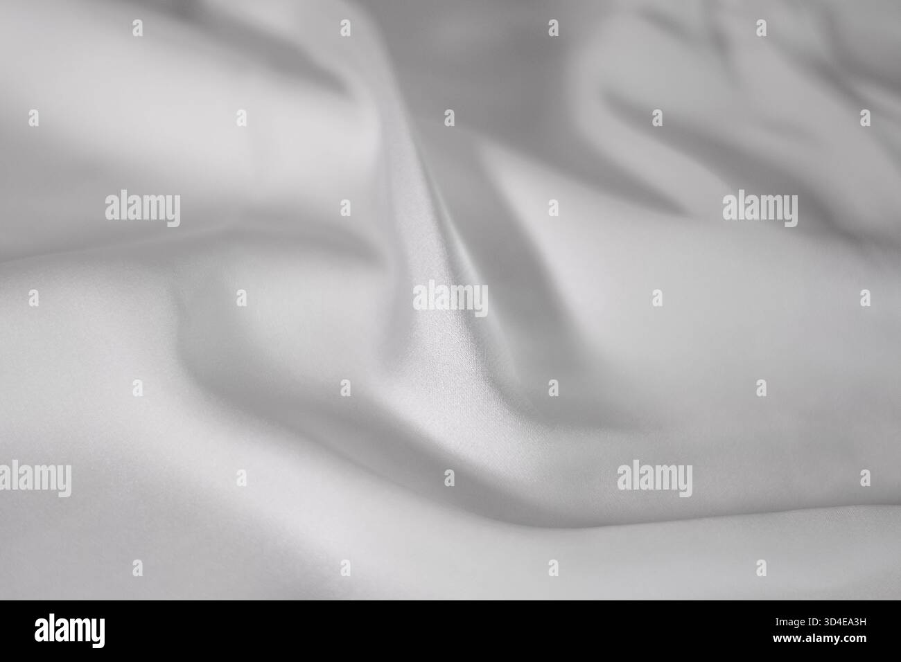 White crumpled satin sheet closeup Stock Photo