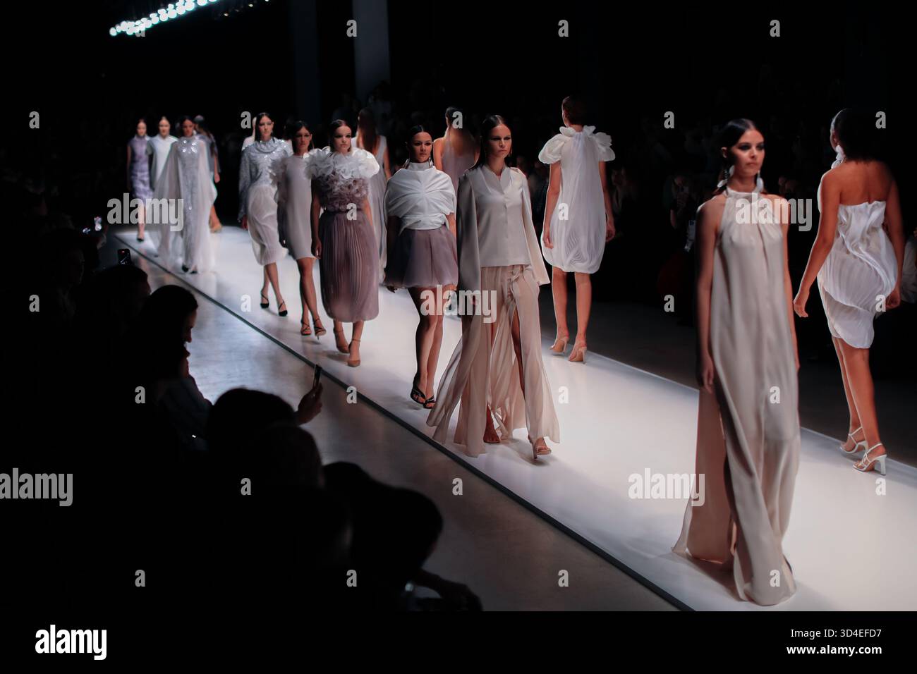 Fashion models wearing elegant chic dresses walking the runway fashion show during the Fashion week, back view Stock Photo - Alamy Fashion models wearing elegant chic dresses walking the runway fashion show during the Fashion week, back view Stock Photo - Alamy