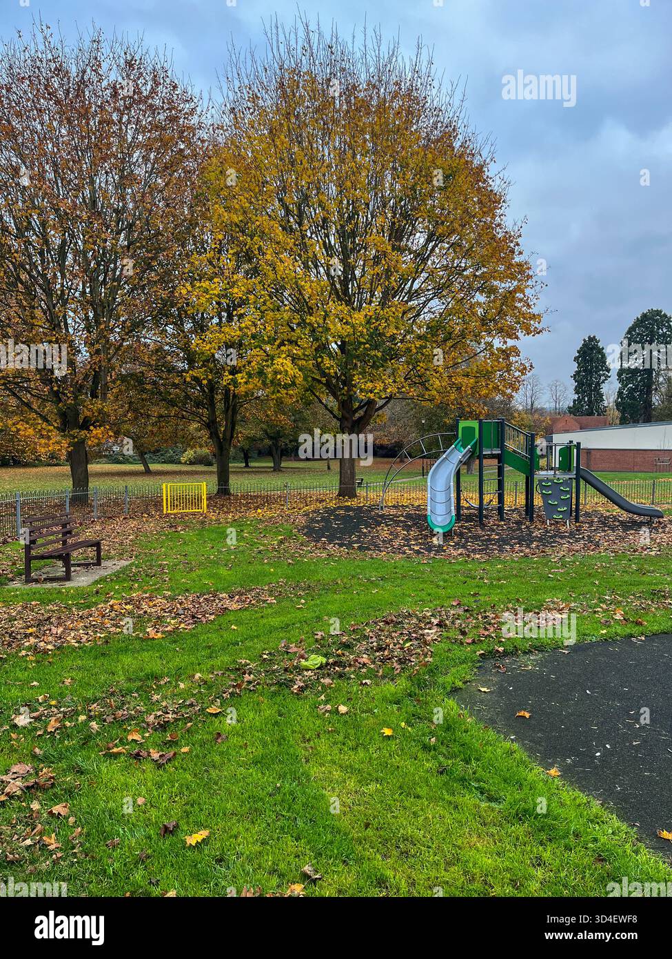 Autumn Children’s Playground with Metal Fence in England - Smartphone Captured Stock Image