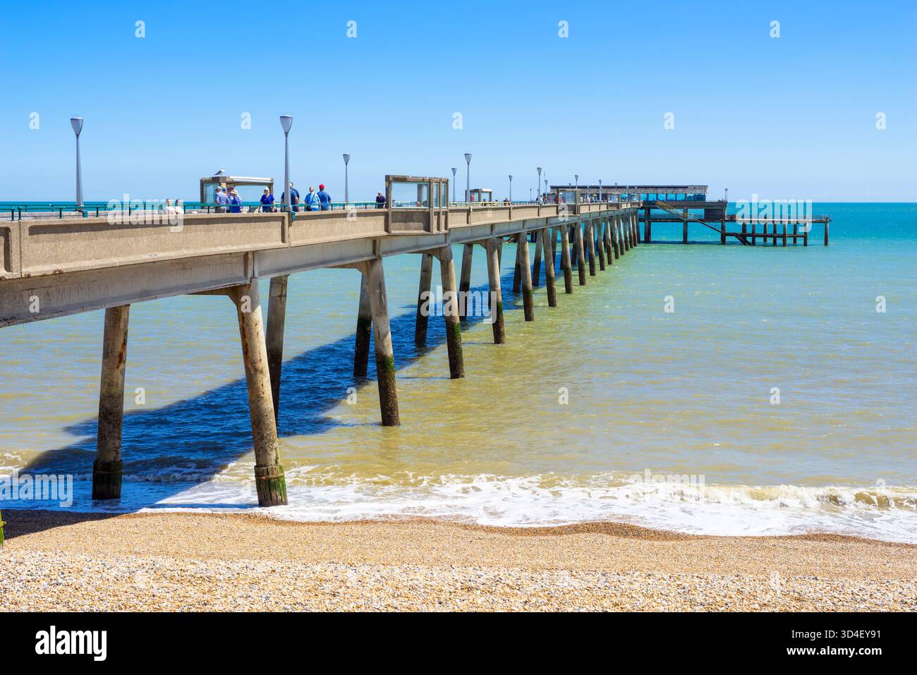Deal Kent - Deal pier Kent - People walking on the pier towards the Deal Pier cafe Deal pier Deal Kent England UK GB Europe Stock Photo