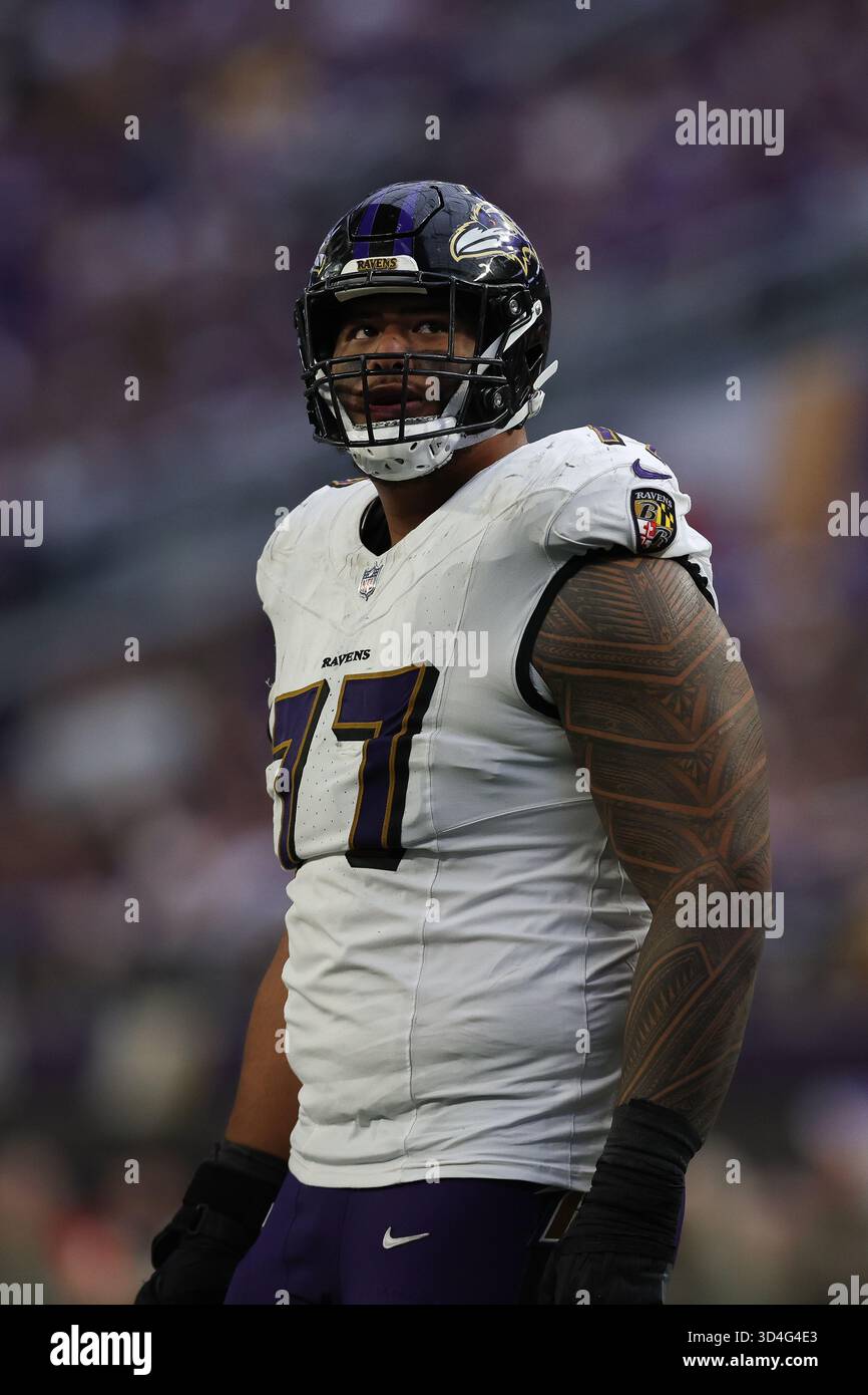 Baltimore Ravens guard Daniel Faalele (77) stands on the field after a ...
