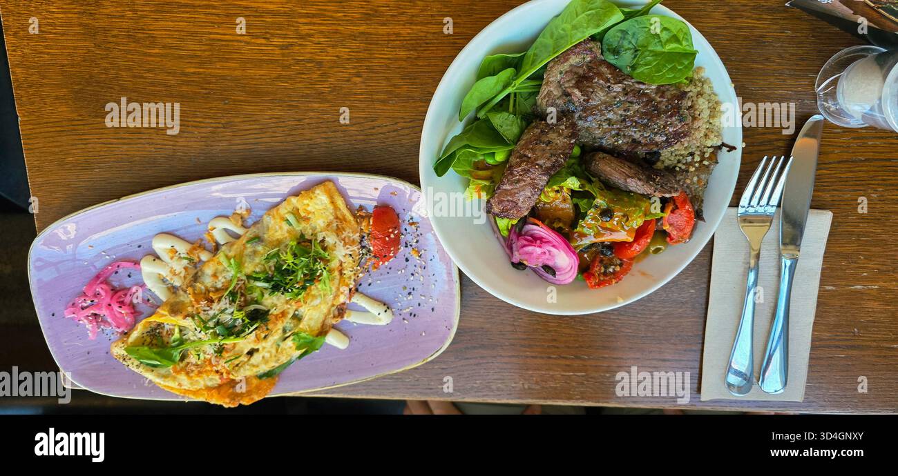 Colorful gourmet meal featuring a variety of fresh ingredients, beautifully arranged on plates, showcasing culinary artistry and vibrant presentation. - Smartphone Captured Stock Image