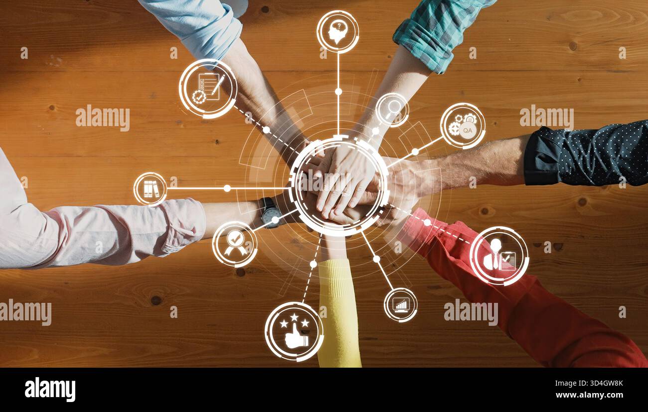 A top view of diverse hands joining together symbolizing collaboration ...