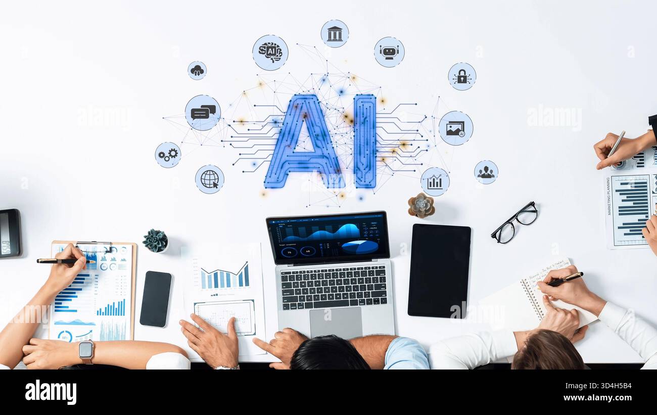 Team members work together on artificial intelligence project, utilizing data analysis tools and innovative concepts in a modern office environment Stock Photo