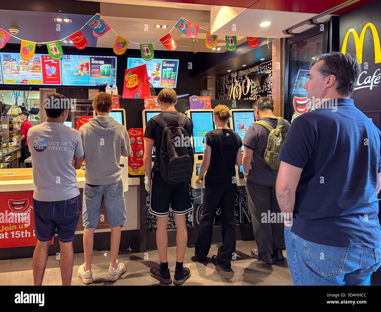 Mcd Customer McDonald's customers use self-service touch screen kiosks to place ...