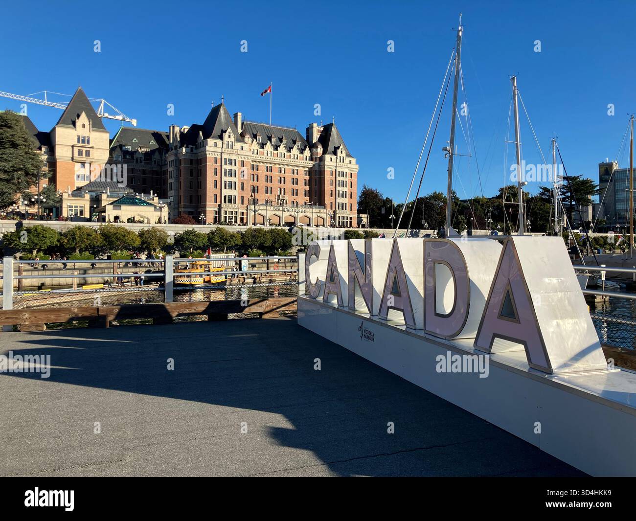 Big CANADA letters with Empress Hotel in background. Inner Harbour, Victoria, Vancouver Island, British Columbia, Canada - Smartphone Captured Stock Image