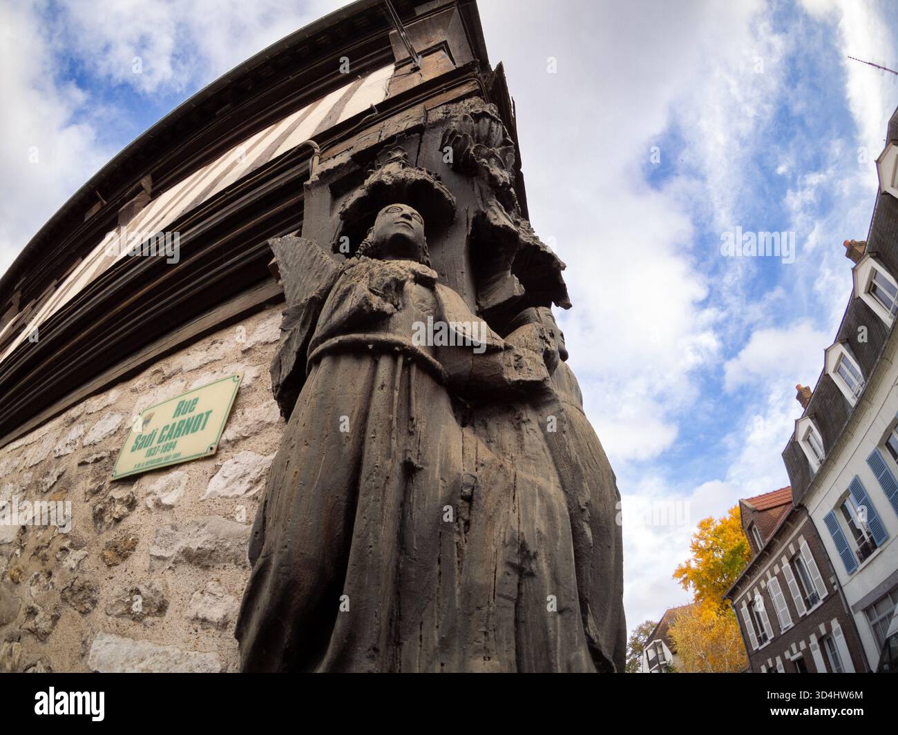 Wooden carving on the corner of Vernon Museum (16th century building), Eure, Normandy, France Stock Photo