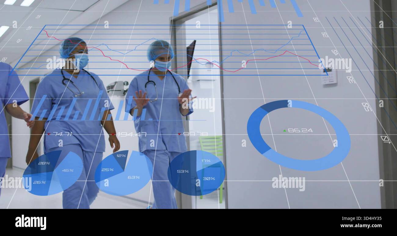 Walking three nurses in blue scrubs and masks gesturing at AR charts in hospital hall, stethoscopes Stock Photo