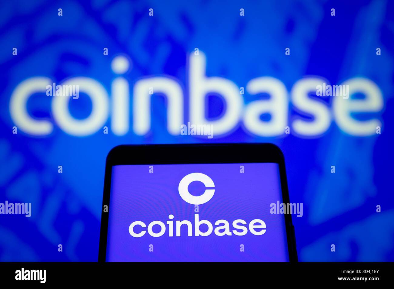 Screens show the logo of Coinbase, the largest cryptocurrency exchange ...