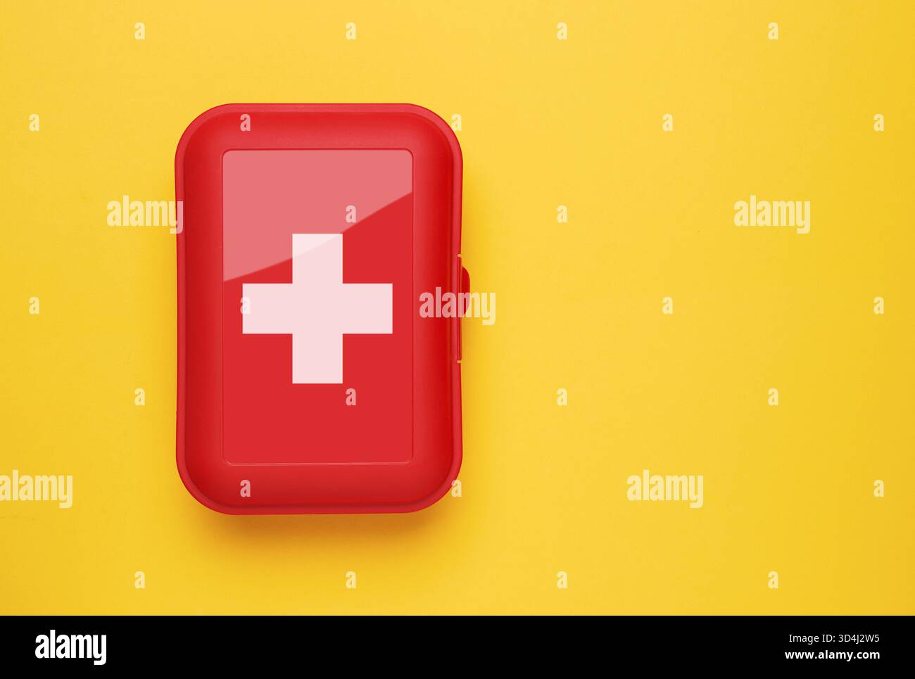 First Aid Kit on yellow background Stock Photo