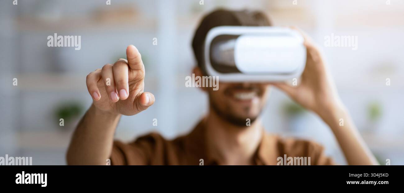 Engaging Experience With Virtual Reality Headset in a Bright, Modern Space Stock Photo