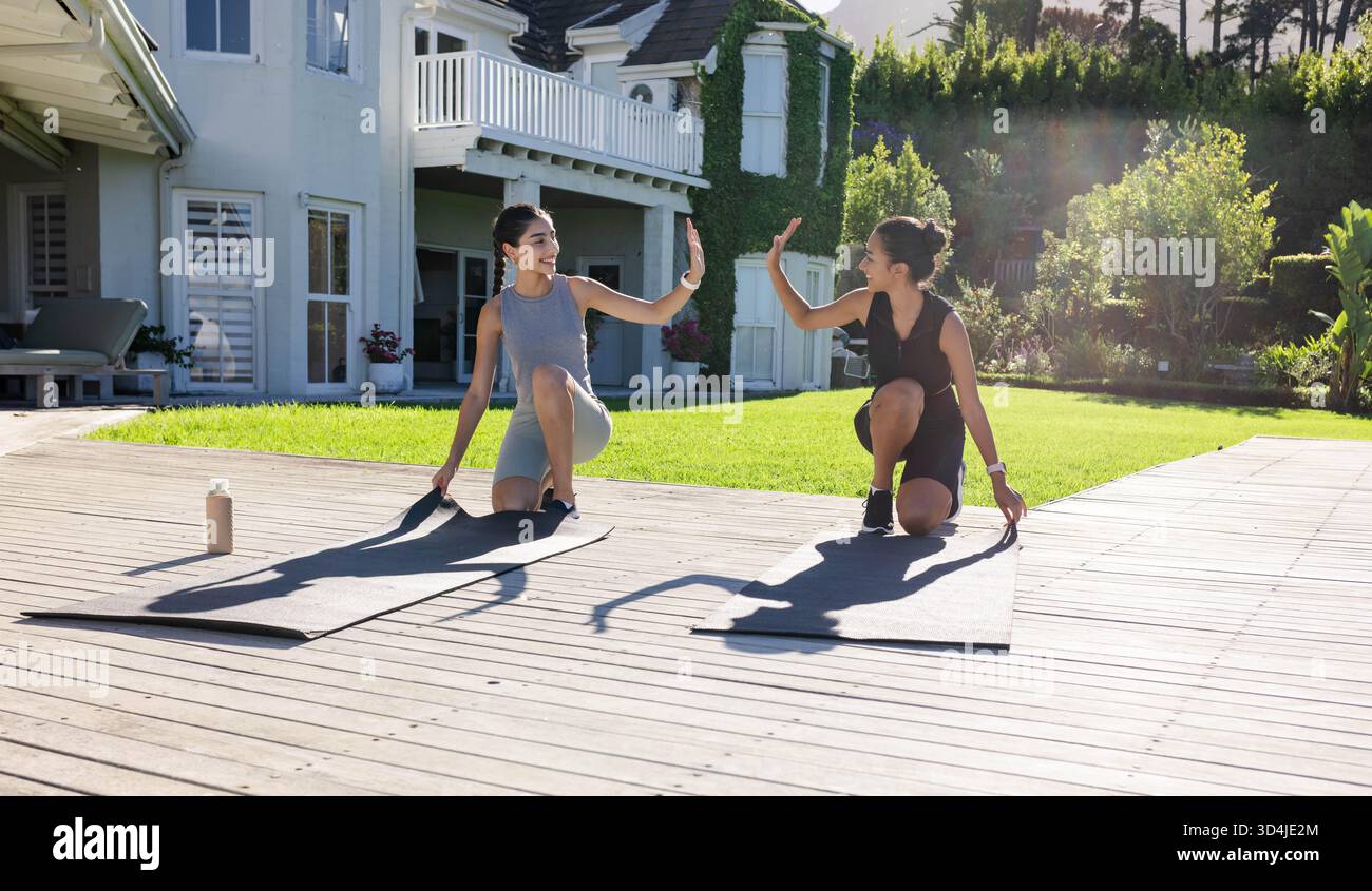 Diverse friends kneeling high hi-res stock photography and images - Alamy