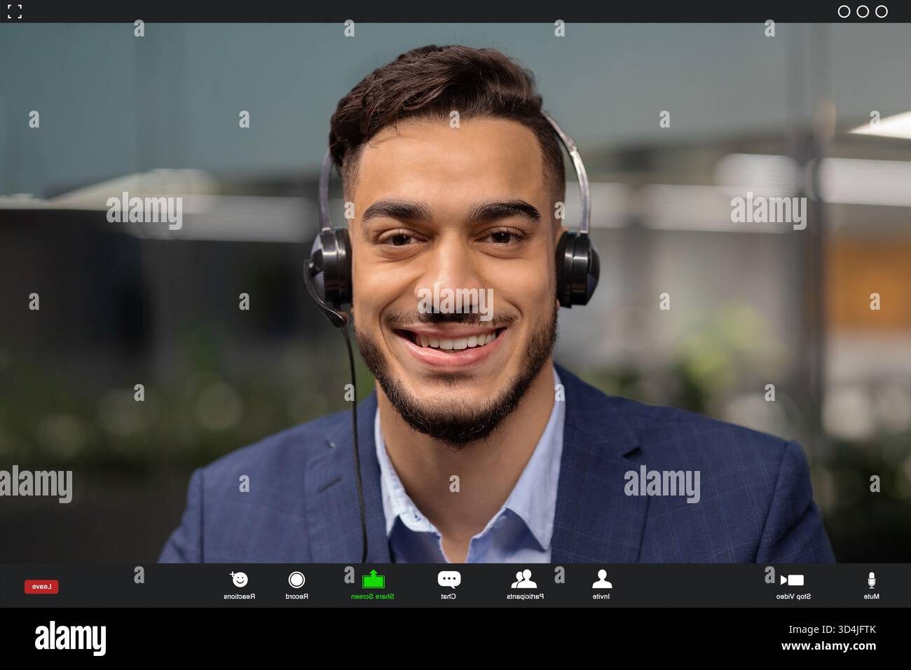Video Chat With a Smiling Middle Eastern Businessman Using Headset for Remote Communication Stock Photo
