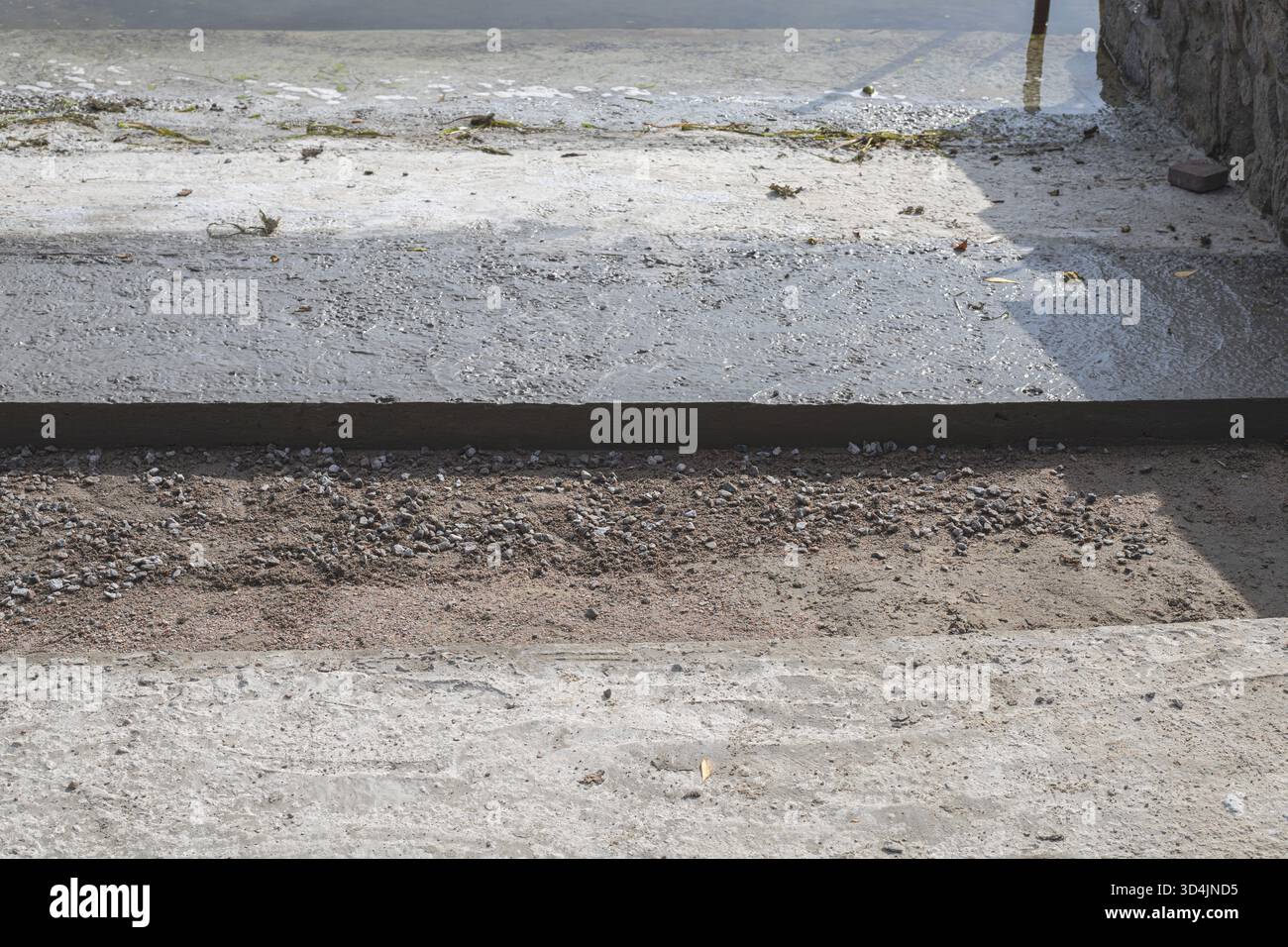 Photo inspiration: Fresh Look at Concrete Walkway Construction With Gravel Base And Stone Wall Details