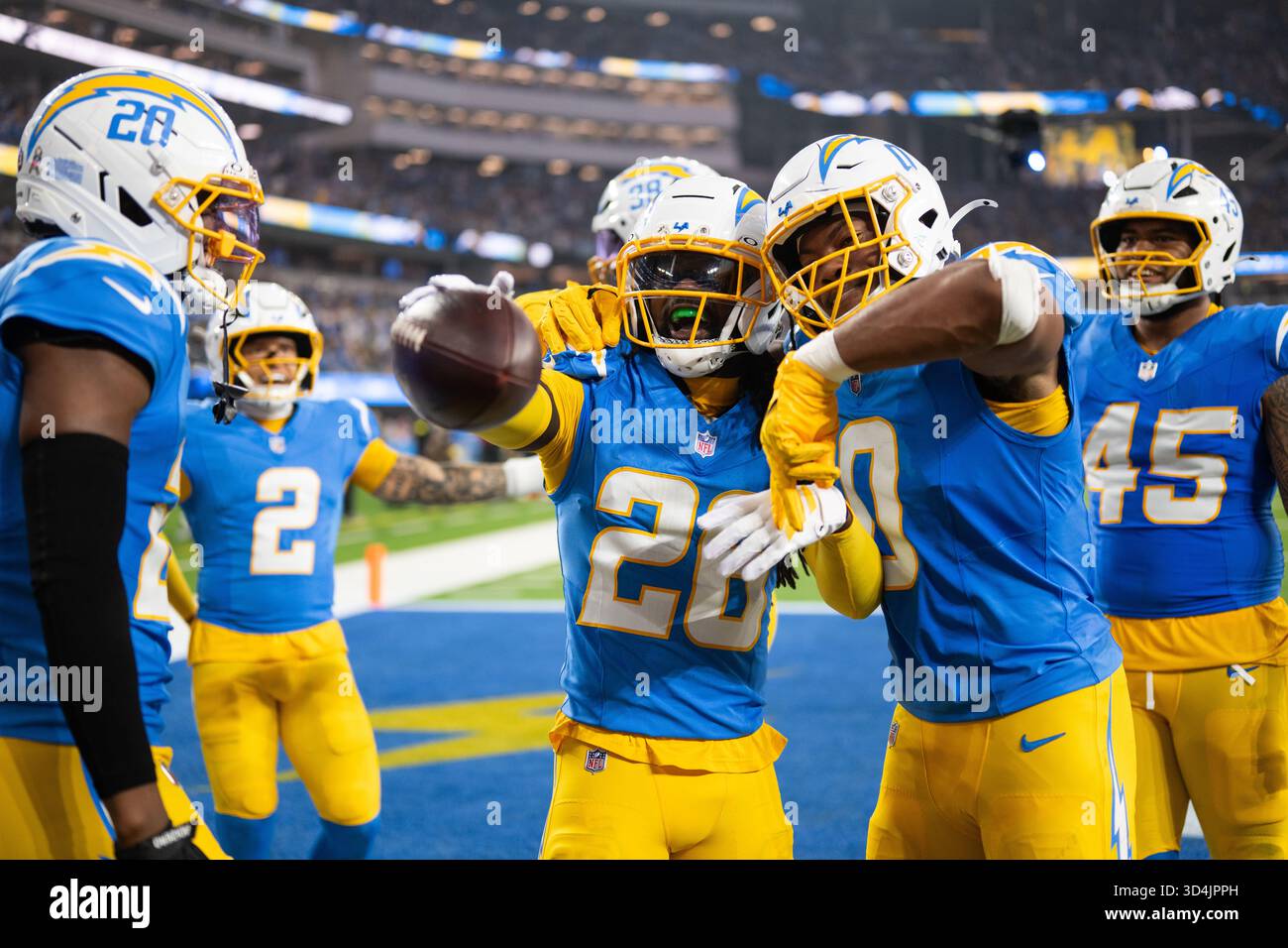 Los Angeles Chargers players celebrate an interception by cornerback ...
