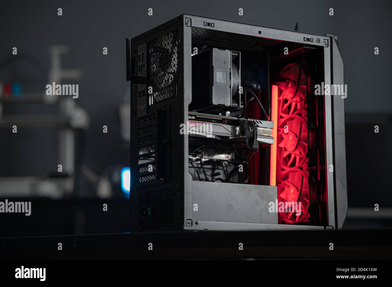 a black computer case without side walls on a blurred background. disassembled computer case Stock Photo