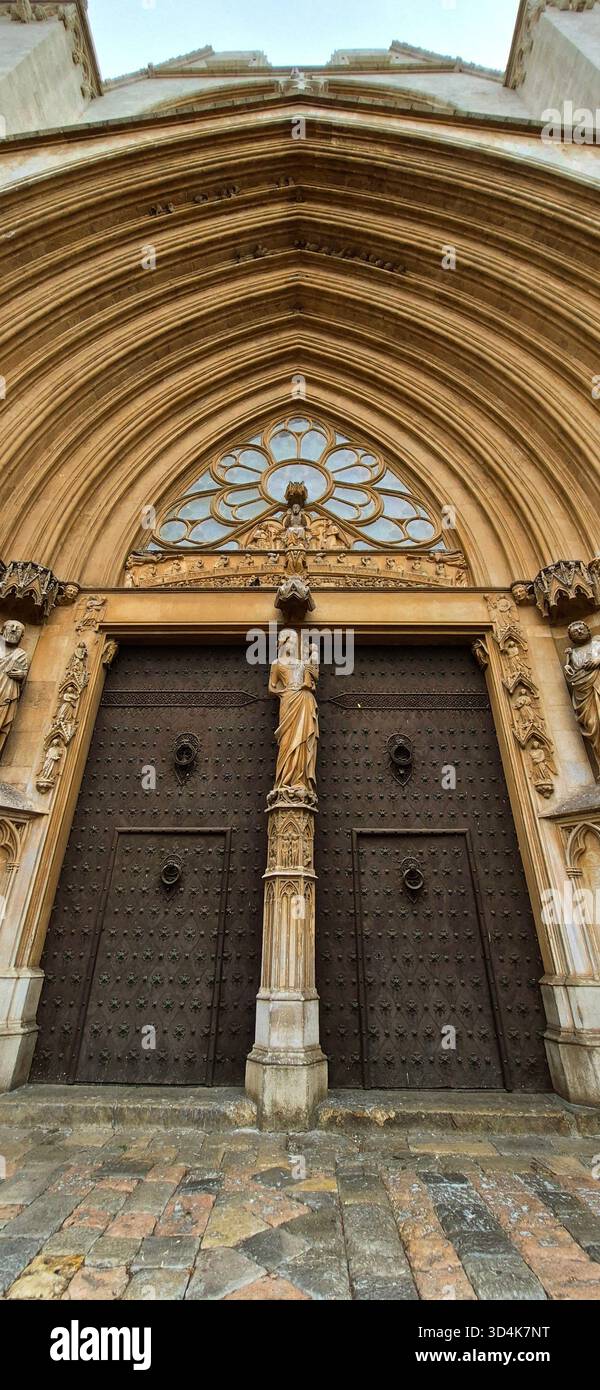 Close-up of the main entrance doors with intrinsic details of the Medieval Romanesque and Gothic style Saint Tecla Cathedral Basilica,Tarragona, Spain. - Smartphone Captured Stock Image