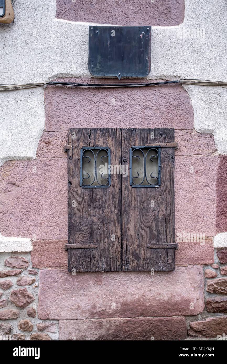 Rustic Closed Wooden Window Shutters on Old Building Stone Wall Facade ...