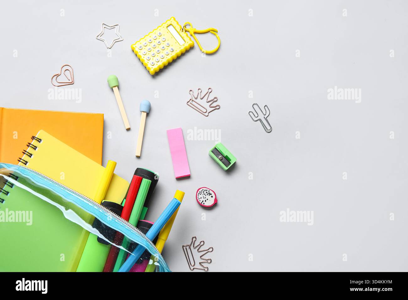 Pencil case with different school stationery on light background Stock Photo