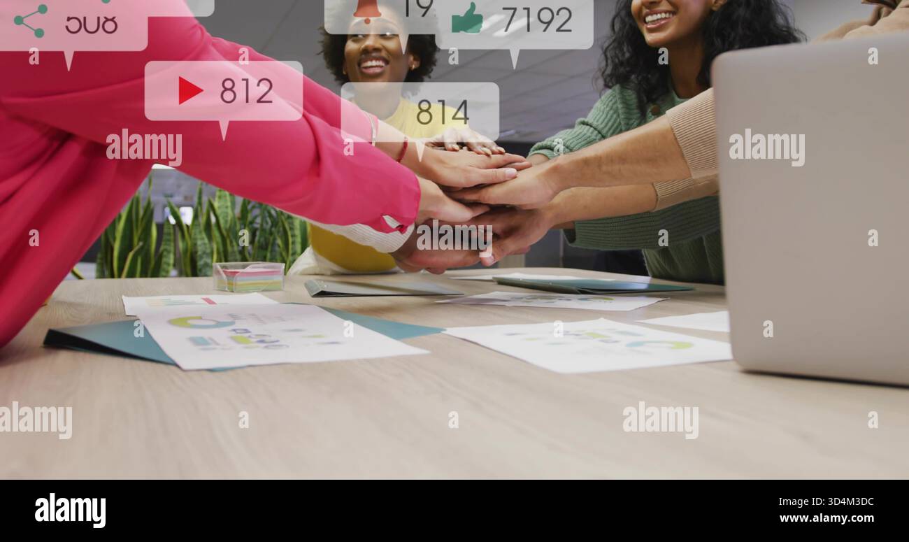 Placing hands, office colleagues collaborating at table with laptop ...