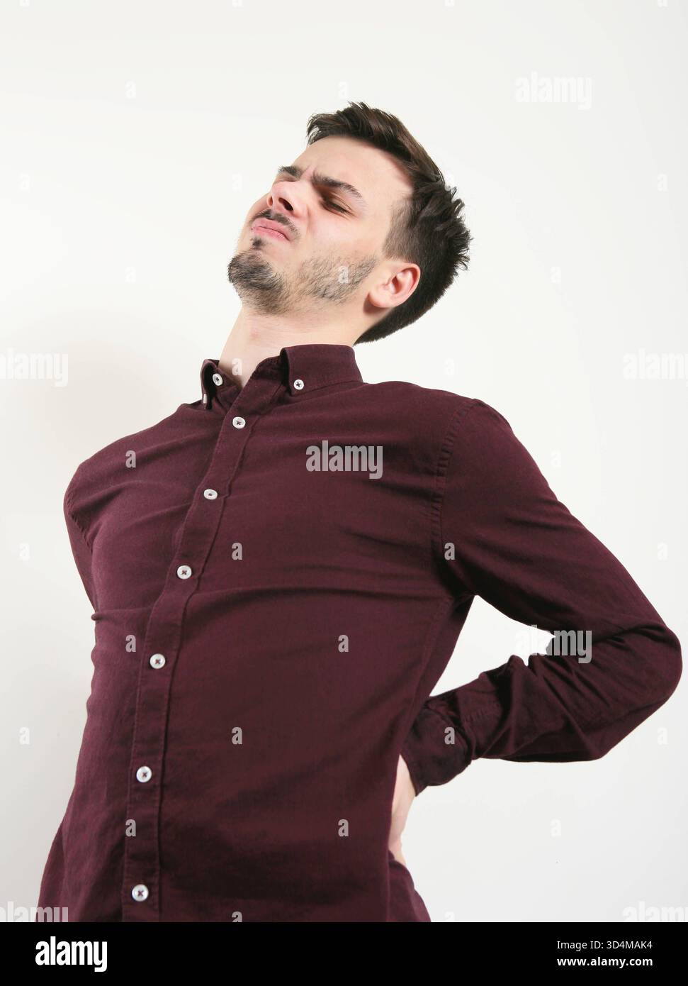 Back pain in a 23-year-old man Back pain 016560 005 Stock Photo - Alamy