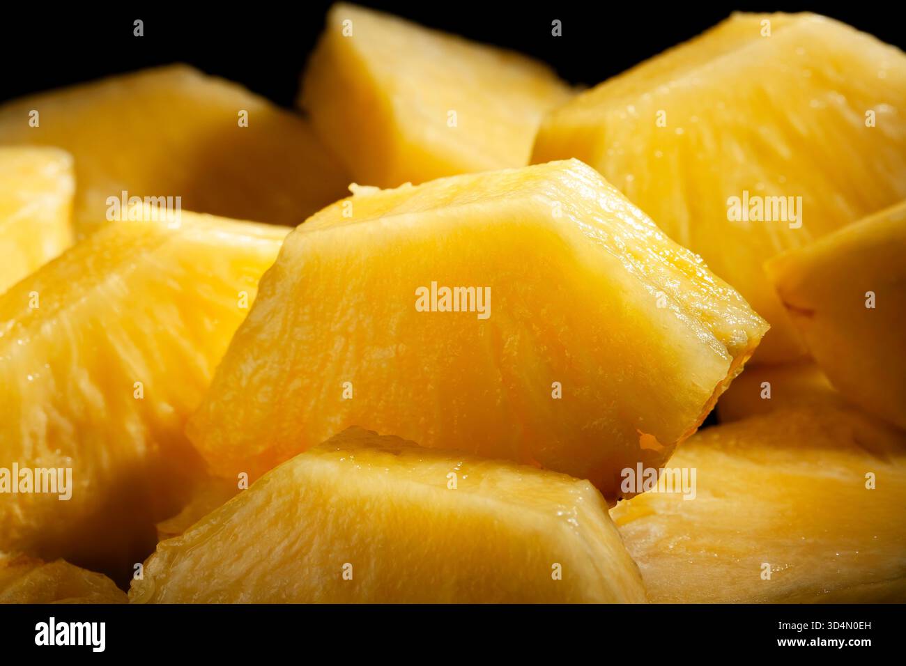 sliced pineapple on black background Stock Photo
