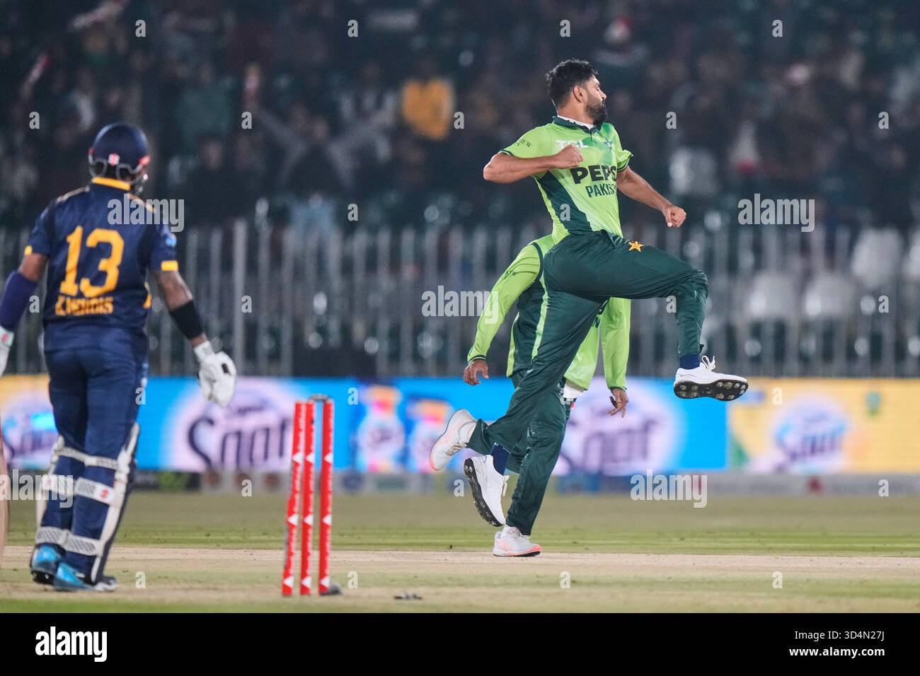 Pakistan's Haris Rauf, right, celebrates after taking the wicket of Sri ...