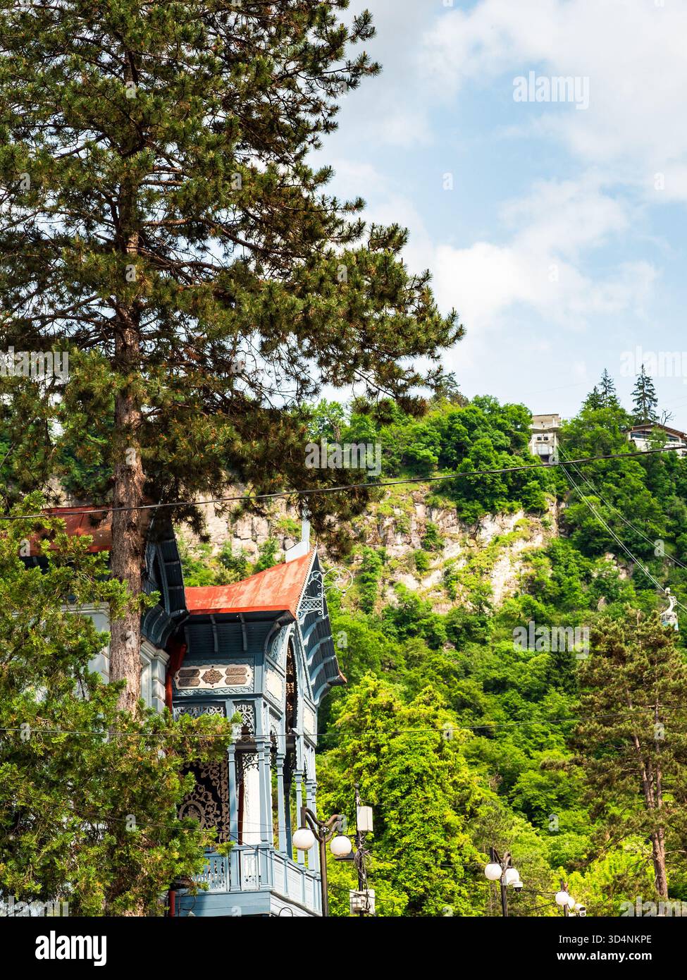 facade of apartment villa Firuze and station of cable car on top of ...