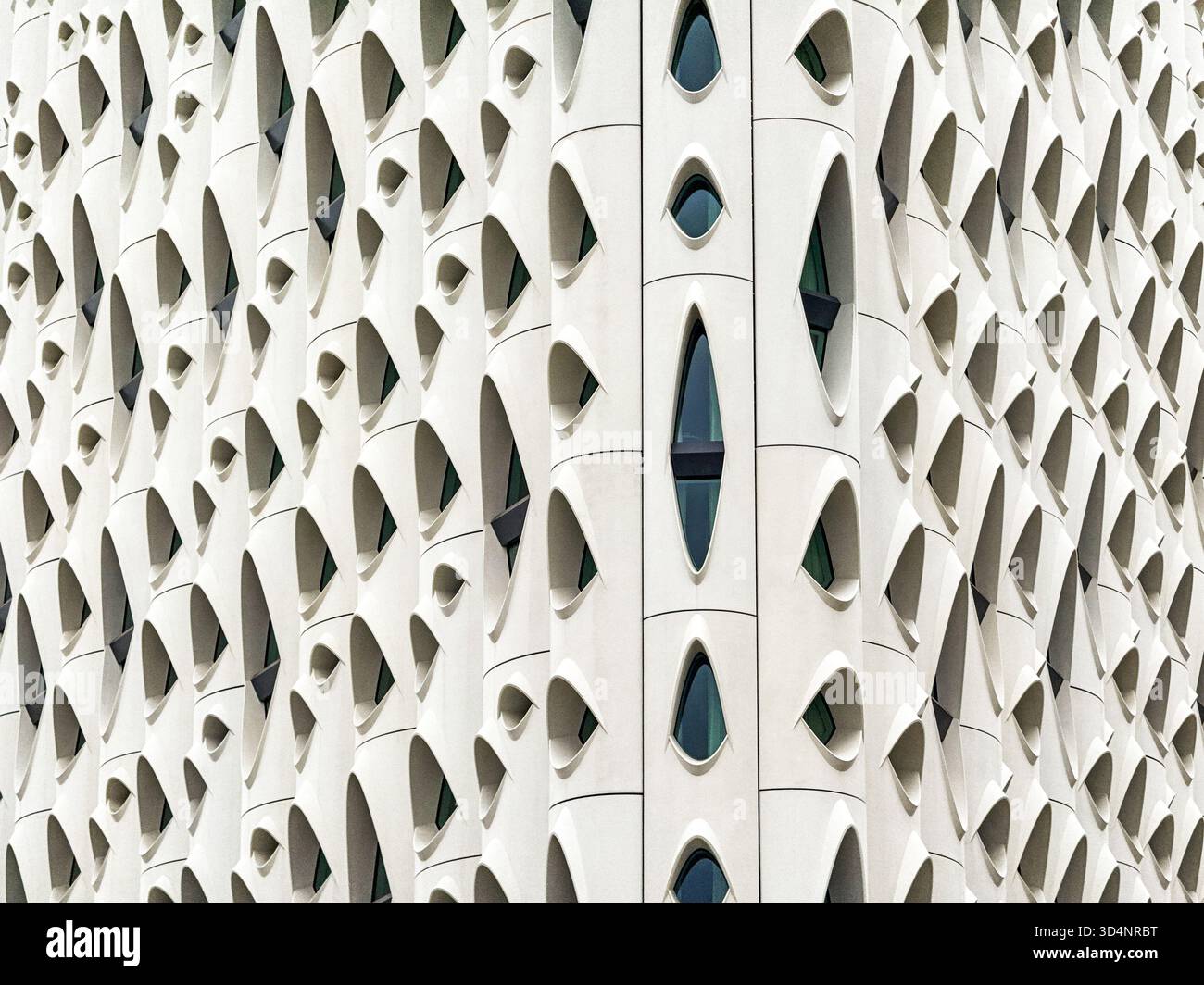 Denver, Colorado, USA - 2 June 2025: Close up of the exterior of the Populus Hotel in downtown Denver. The design has been compared to that of a chees - Smartphone Captured Stock Image