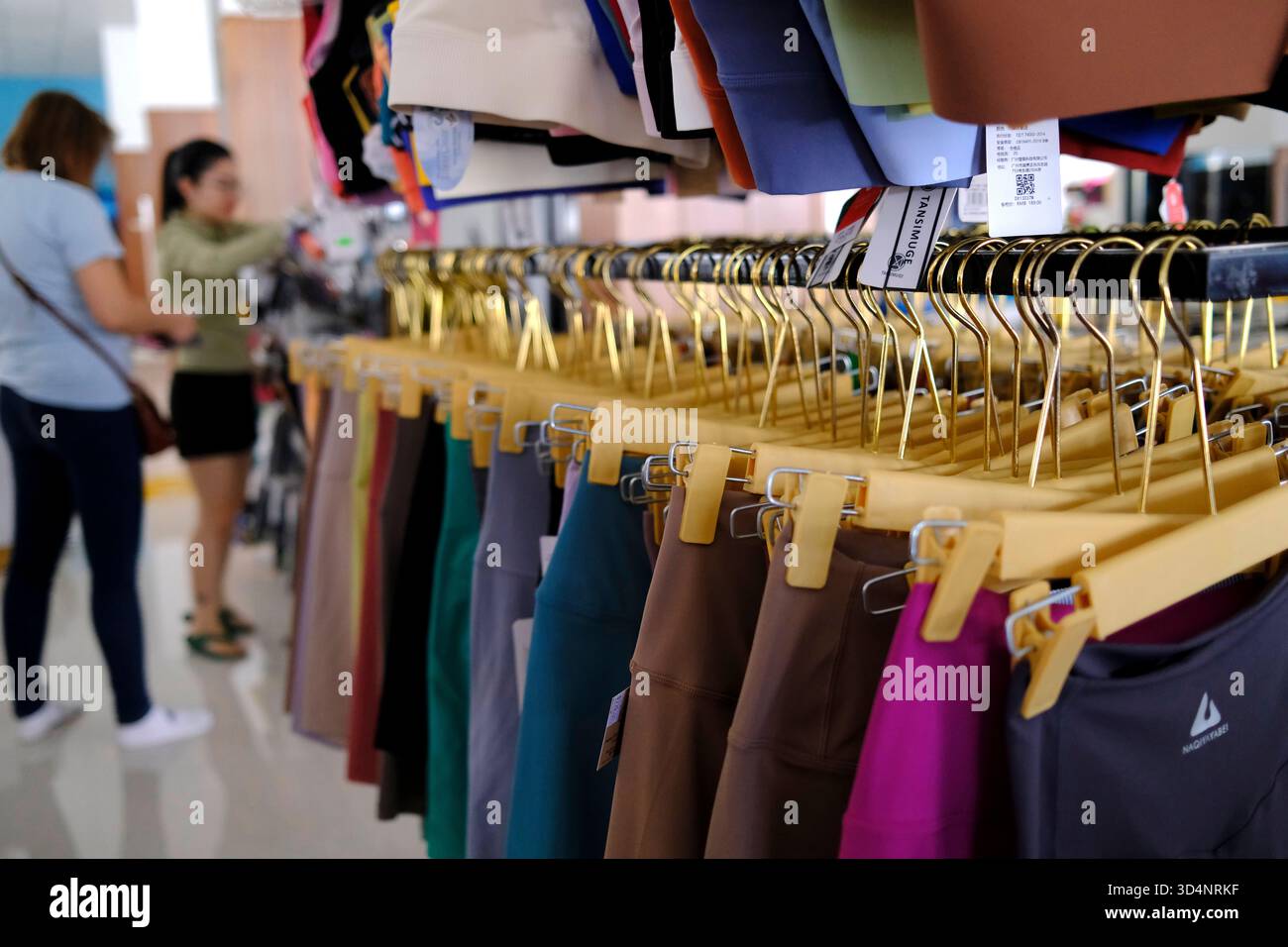 Store selling clothing of different brands for sports. Kontum. Vietnam. Stock Photo