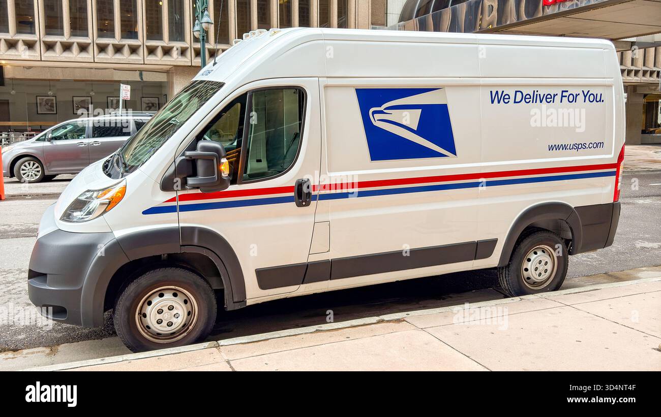 Denver, Colorado, USA - 2 June 2025: Mail delivery van used by the United States Postal Service parked on a street in downtown Denver. - Smartphone Captured Stock Image