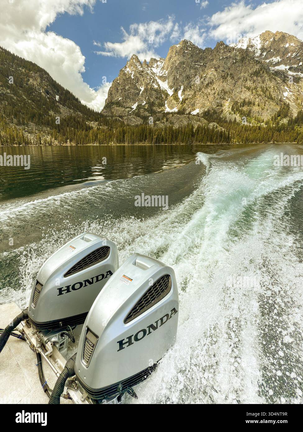 Jackson, Wyoming, USA - 28 May 2025: Wake from a fast boat powered by Honda electric outboard motor engines on Sally Lake in the Grand Teton National - Smartphone Captured Stock Image