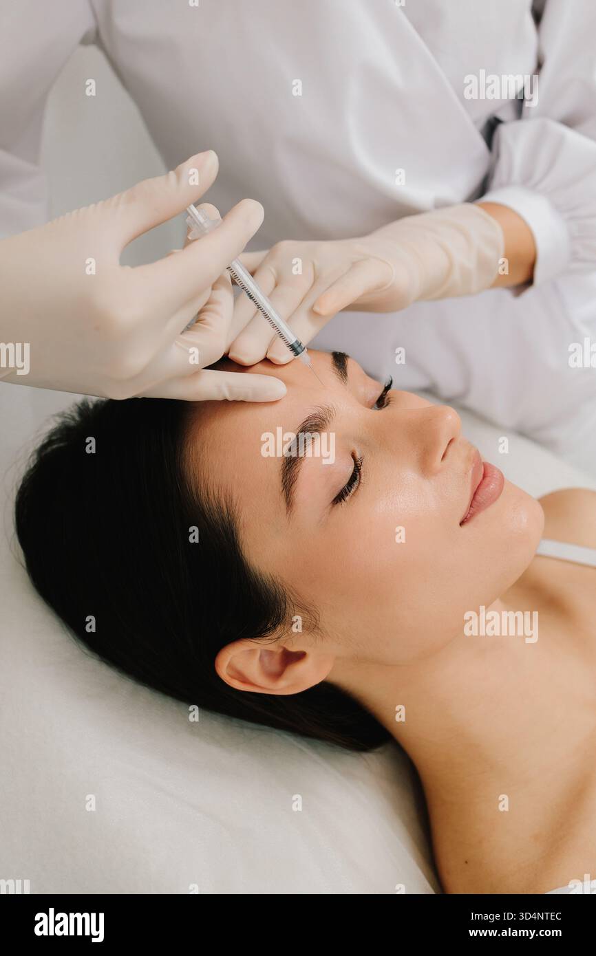 Glabellar Botulinum Toxin Injection close-up. Anti-wrinkle therapy ...