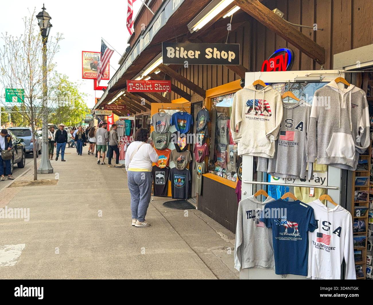 West Yellowstone, Montana, USA - 28 May 2025: Person browsing gifts and souvenirs in one of the shops on the main street of West Yellowstone. - Smartphone Captured Stock Image