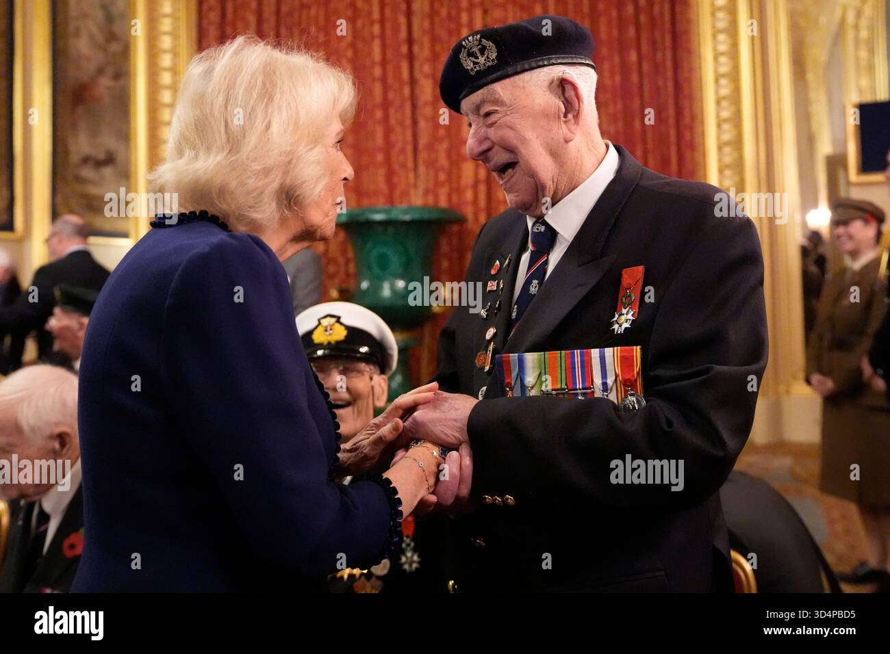 Queen Camilla and veteran Henry Rice at a reception for veterans who ...