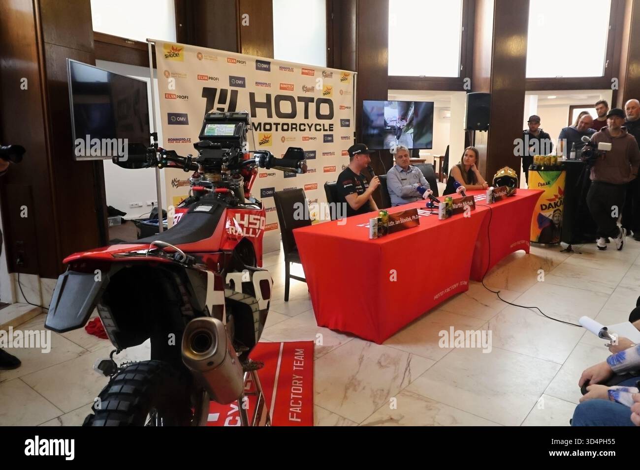 Racer Martin Michek speaks at a press conference where his new factory ...