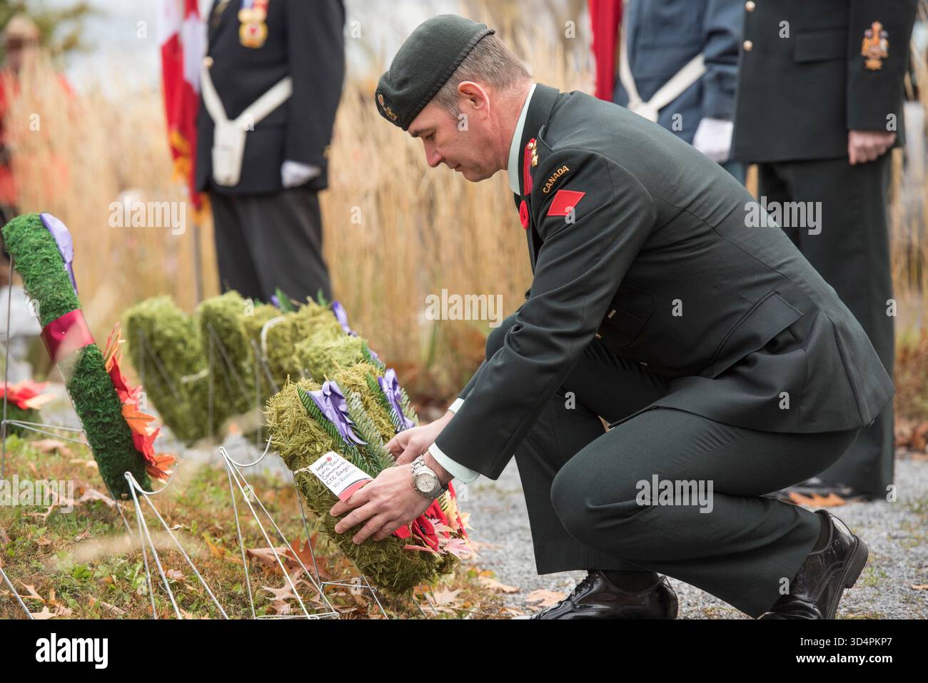 Col. Loic Darras, commander of CTC Gagetown, places a wreath during the ...