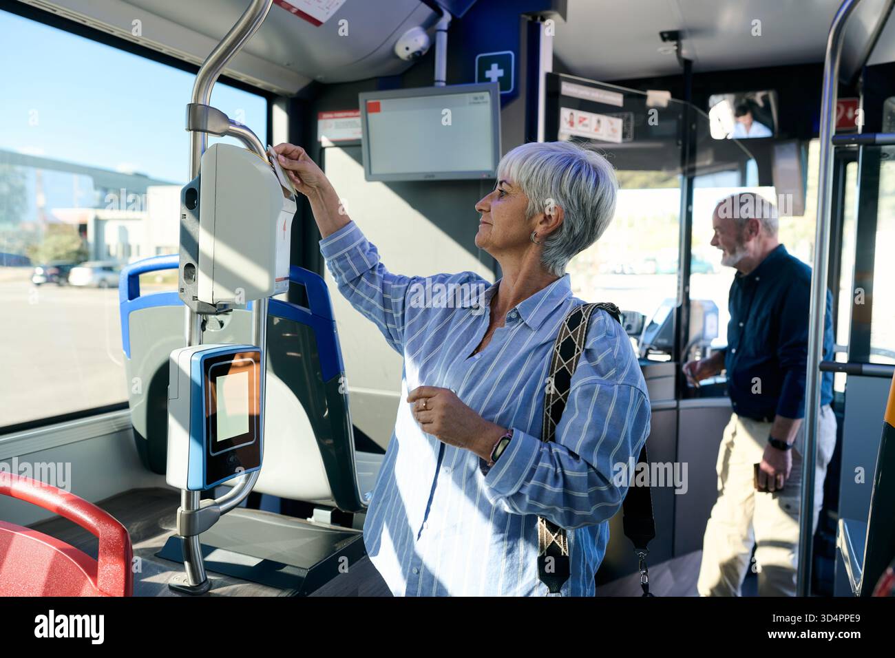 Woman validating public transport hi-res stock photography and images ...
