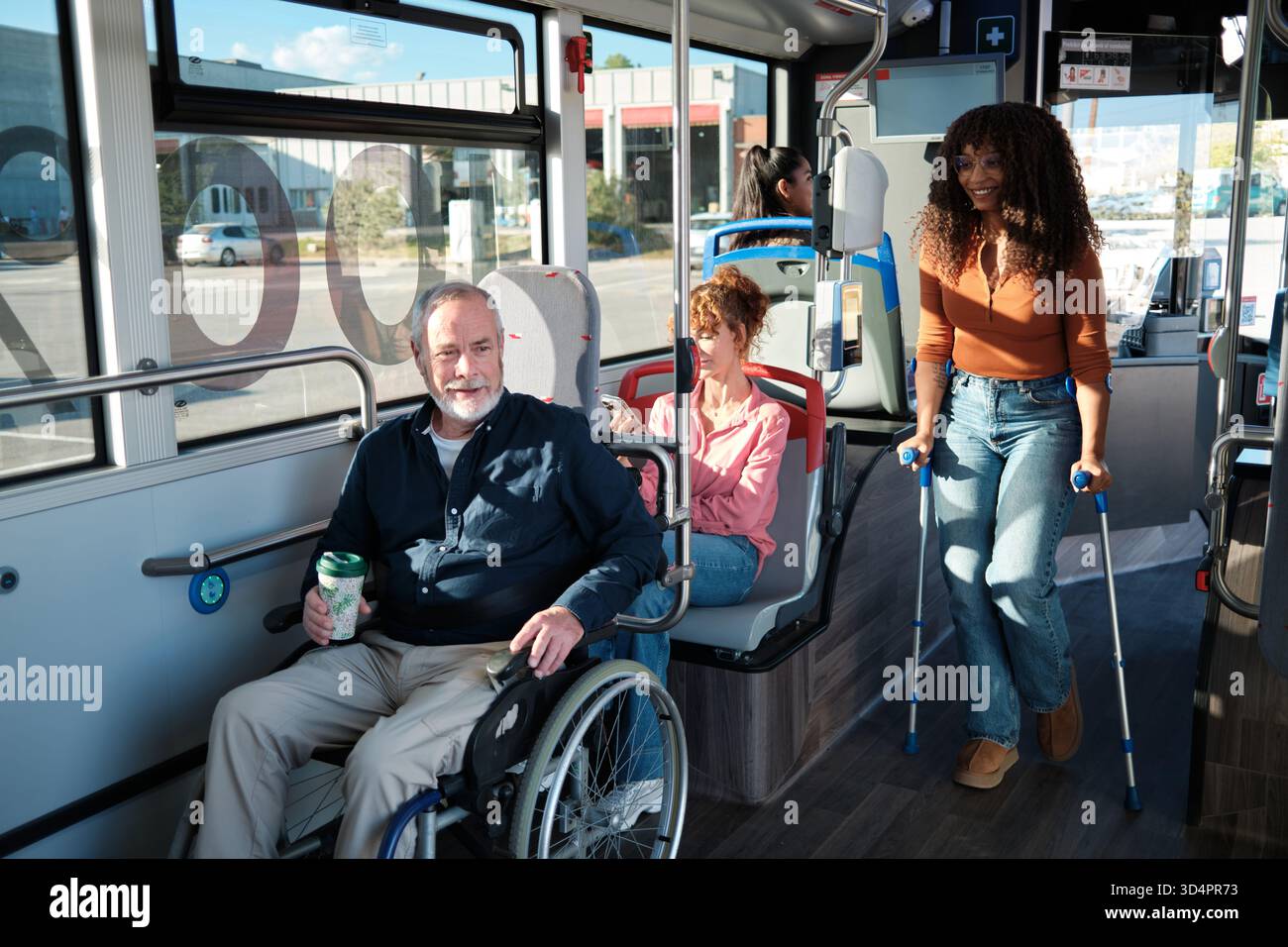Diverse passengers using public transport with disabilities Stock Photo