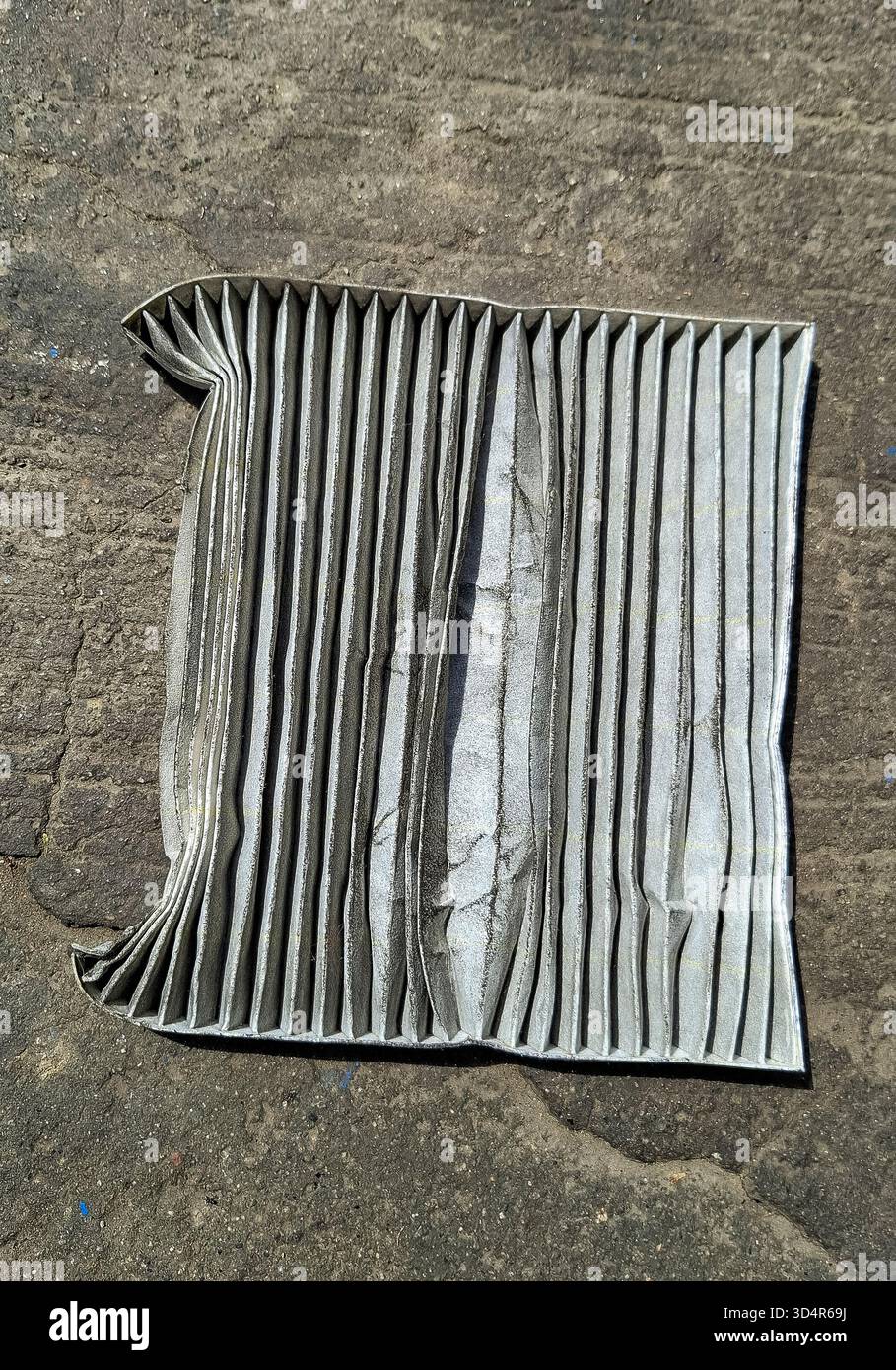 A dirty and destroyed car air conditioning filter Stock Photo