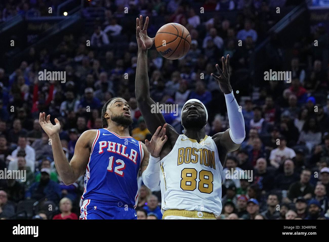 Boston Celtics' Neemias Queta (88) wins the rebound over Philadelphia
