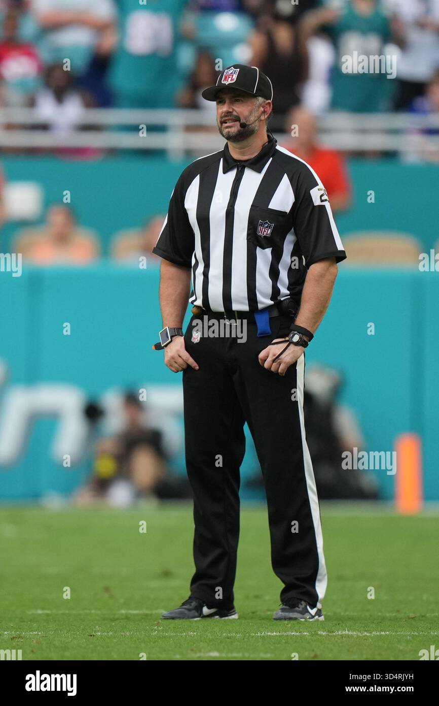 Ryan Dickson field judge Ryan Dickson (25) waits for a huddle to finish during an ...