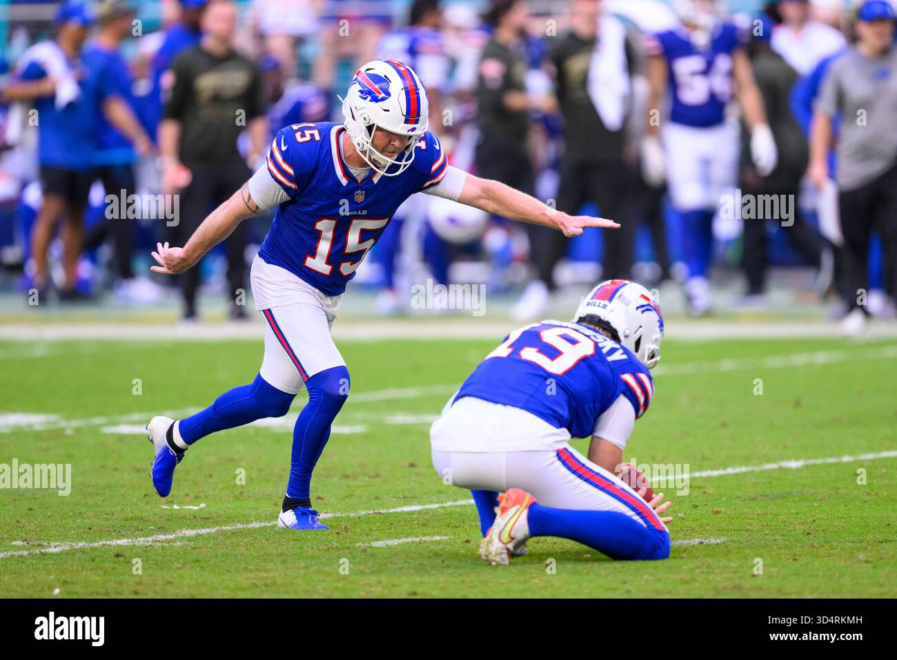 Buffalo Bills punter Mitch Wishnowsky (19) holds the ball as kicker ...