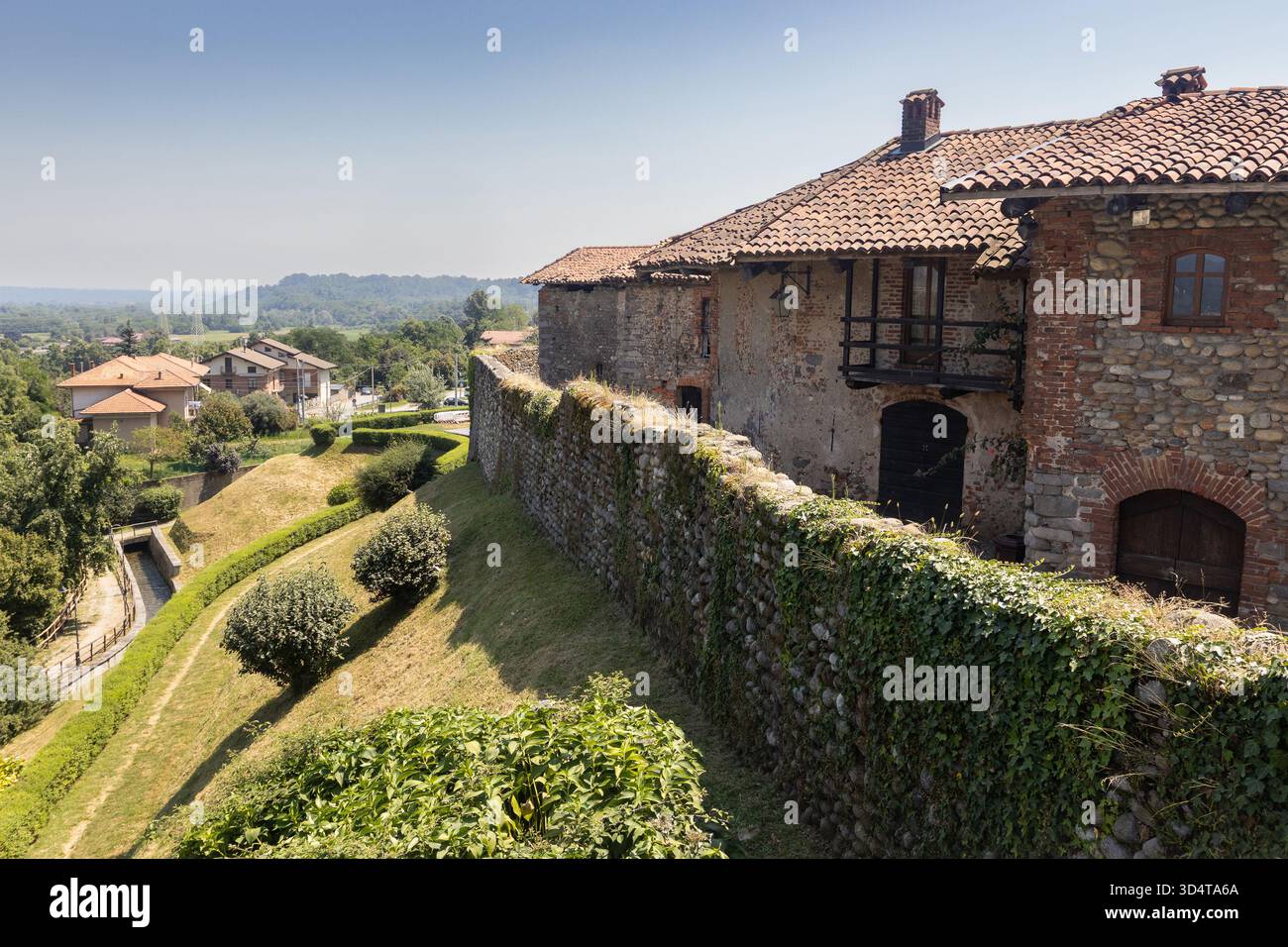 CANDELO, ITALY, 28 JULY 2024: Medieval wall and old buildings at the Ricetto di Candelo. The collection of medieval buildings in the Ricetto, near Bie - Stock Image