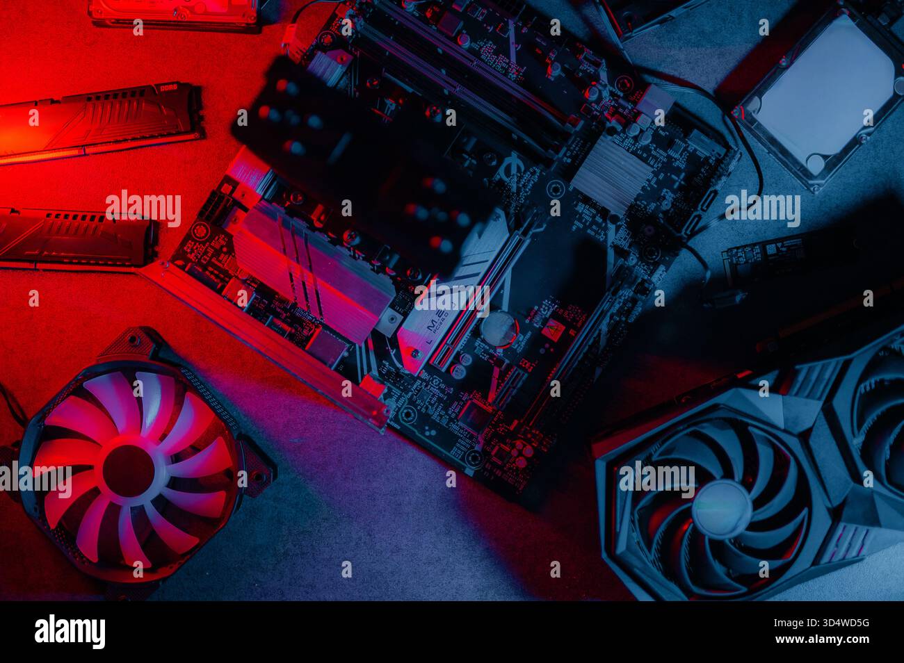 Graphics card and other computer hardware on grey textured table, flat lay. Space for text. Stock Photo