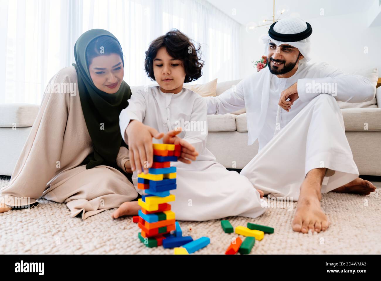 Middle-eastern family wearing traditional emirati clothing spending ...