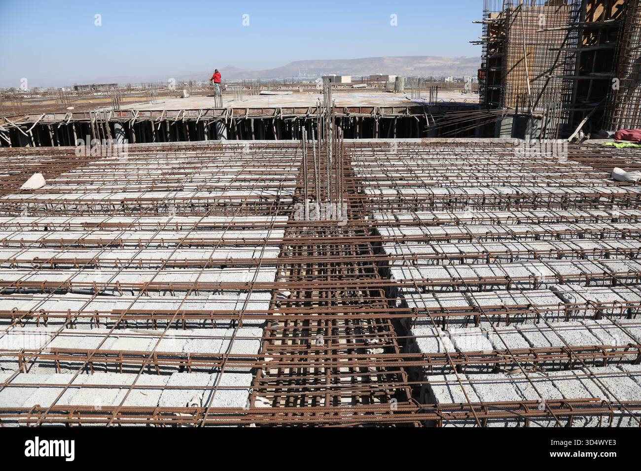 Concrete Casting Process for New Floor Slab on Skyscraper Construction Site. Stock Photo